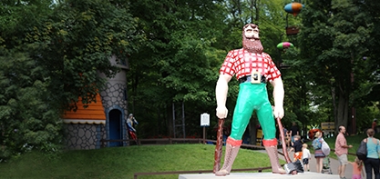 photo of Paul Bunyan holding wood and his axe