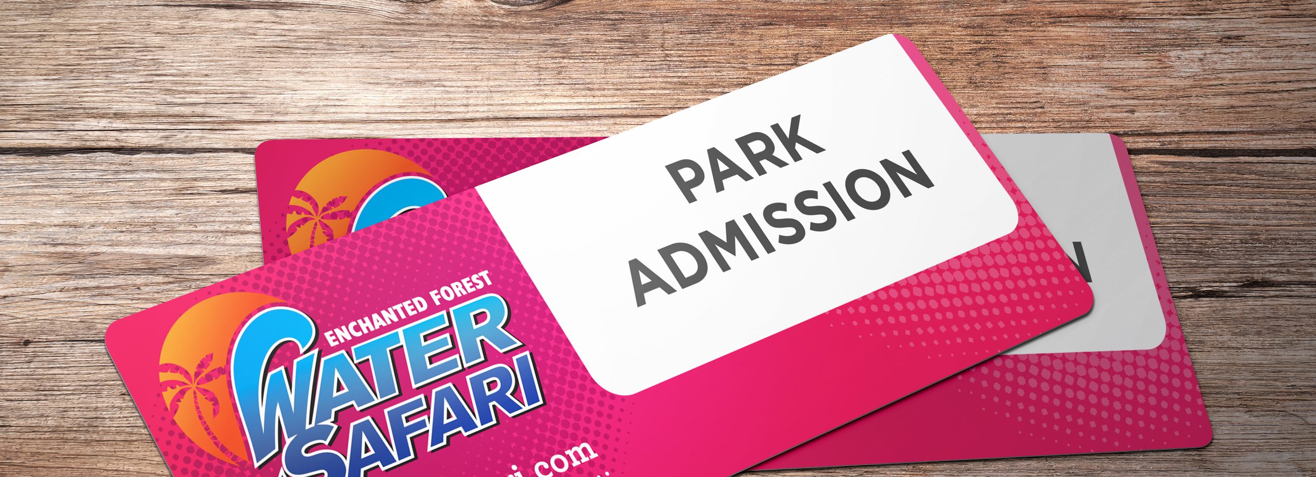 Image that shows the park admission passes. The passes have a bright pink background whit the water safari logo on the left hand side. it has water safari.com written on the bottom and then it says under that, void if resold. No refunds or rain checks.