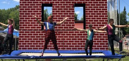 Circus performers doing a trampoline stunt